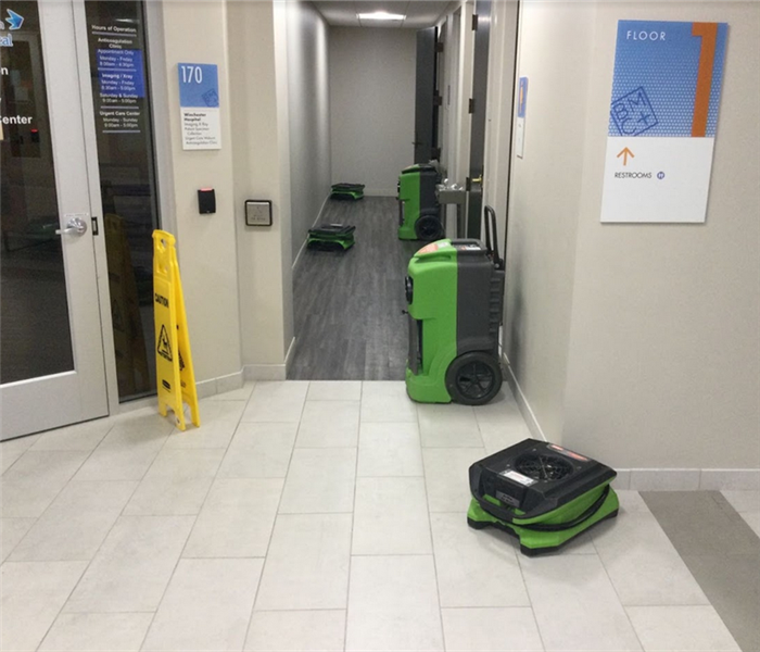 SERVPRO equipment working in a hallway