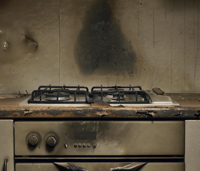 Smoke stained oven in kitchen after fire